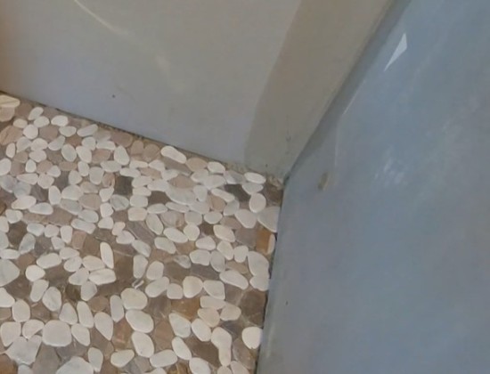 cleaning-pebble-stone-shower-floor